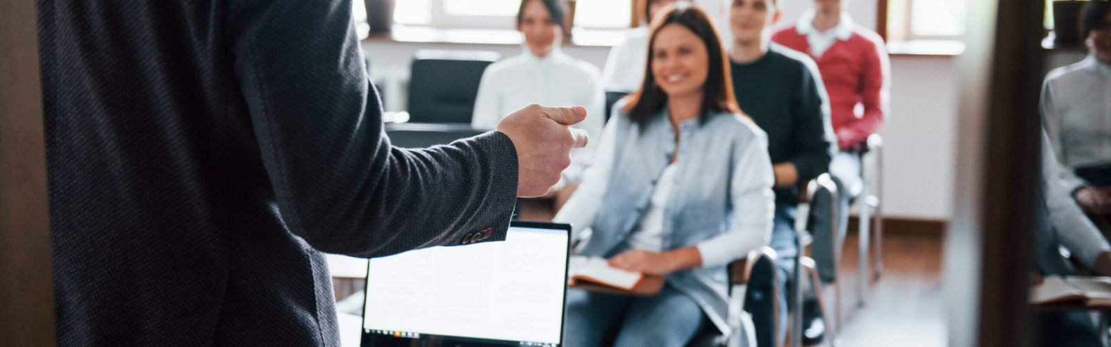 Cheerful mood. Group of people at business conference in modern classroom at daytime Cheerful mood. Group of people at business conference in modern classroom at daytime.